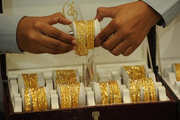 Gold declines on subdued demand, silver recovers